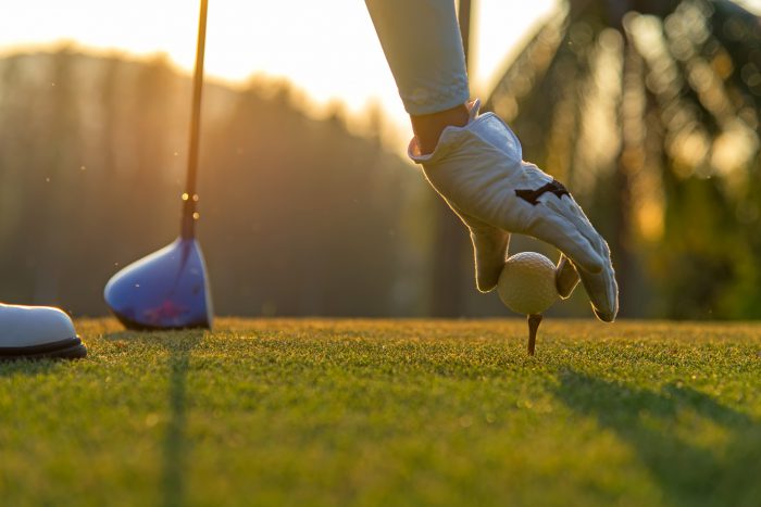 golfer putting the golf ball